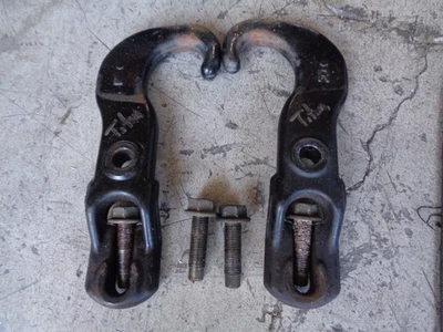 Pair of Factory Tow Hooks (w/bolts) 2004-2015 Nissan Titan Armada - Image 1 of 3