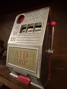 ANTICO distributore automatico moneta in metallo BANCA 1¢, 5¢ e 10¢ plastica Reno MFG - Foto 1 di 15