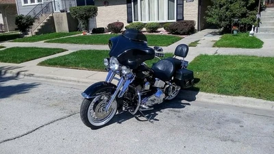 Carenado de murciélago parabrisas Harley Heritage Softail Fat con ámbar pintado LED 18-25 Foto 1 de 4