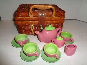 children's tea set in wicker basket