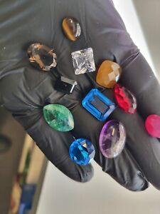 Lot of 11 gem stones,emerald,blue saphire,topaz,ruby,amethyst....