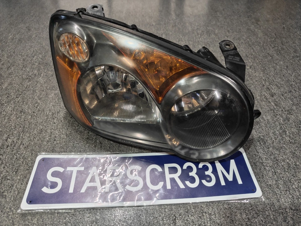 Faro de pasajero Subaru Impreza 2004-2005 genuino gris oscuro carcasa WRX Foto 1 de 4