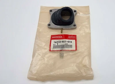 HONDA MTX125 MTX125R MTX125RW INSULATOR, CARBURETOR NOS JAPAN 16210-KE1-010 Foto 1 de 4