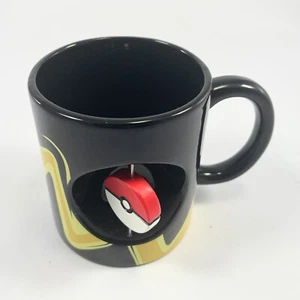 Taza de cerámica giratoria Pokemon Pikachu y Pokeball - 16,9 onzas negra 2016 - Imagen 1 de 6