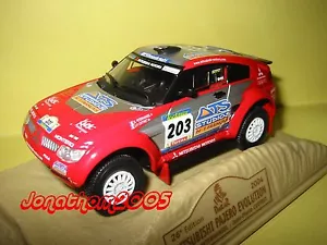 NOREV MITSUBISHI PAJERO EVOLUTION N° 203 DAKAR 2004 PETERHANSEL au 1/43° - Foto 1 di 1