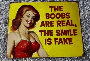 Ephemera The Boobs are Real The Smile Is Fake Humor Funny Retro Metal Tin Signs - Picture 1 of 3