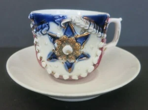 VINTAGE BEADED PORCELAIN DEMITASSE TEA CUP & SAUCER PINK WHITE & BLUE W/ STAR - Picture 1 of 1