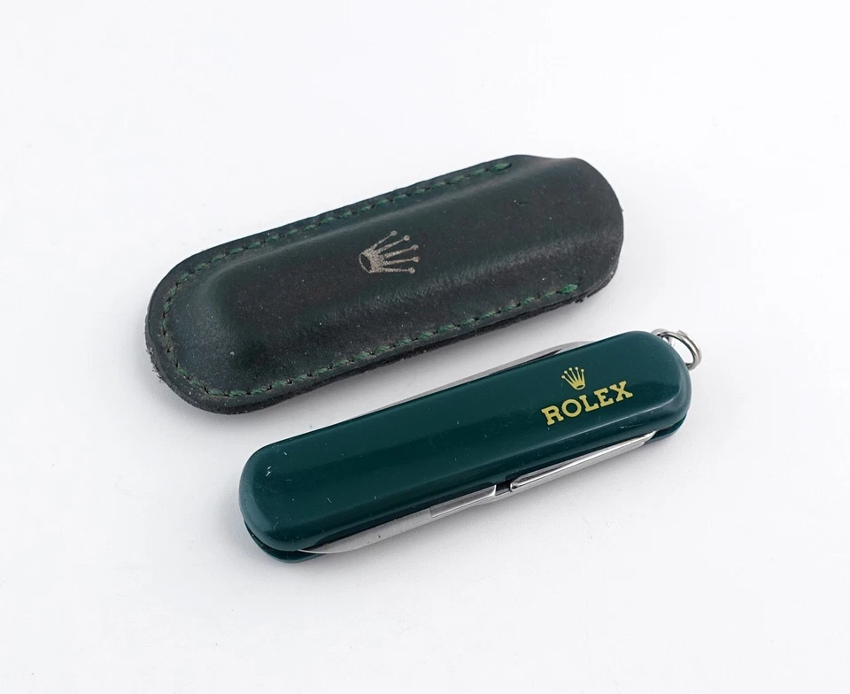 Navaja de bolsillo Rolex / multiherramienta con soporte de cuero firmado (artículo #439) Foto 1 de 4