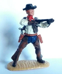 FIGURINE TIMPO TOYS - COW BOY tirant au fusil - CHAPS / JAMBIERES NOIRES / BRUN - Picture 1 of 9