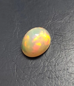 Opale etiope naturale cabochon, pietra preziosa opale etiope, forma ovale 12x9,50 mm - Foto 1 di 2