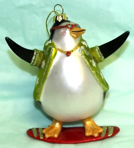 COLORFUL BLOWN GLASS PENGUIN ON A SURFBOARD CHRISTMAS ORNAMENT ABOUT 4" TALL - Picture 1 of 2
