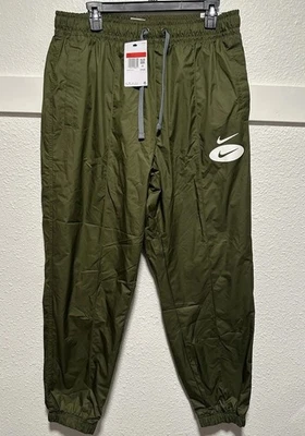 Pantalones forrados tejidos verdes para hombre Nike Sportswear Swoosh League L DM5485-326 Foto 1 de 4