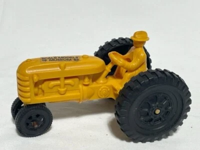 Scale Models National Farm Toy Museum 1983 Yellow Plastic Tractor w/ Man - Image 1 of 3
