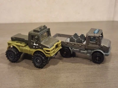 2017 MATCHBOX JURASSIC WORLD MERCEDES-BENZ UNIMOG LOT OF 2. U1300. **See Desc** - Image 1 of 4