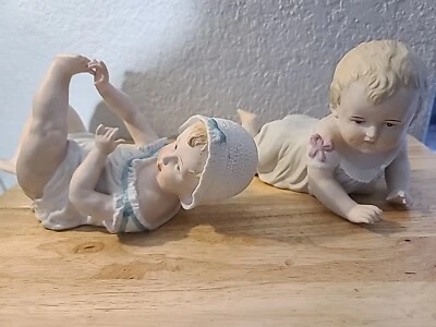 Pair Of Antique German Gebuder Heubach Bisque Piano Babies Doll Figurines.  - Image 1 of 4