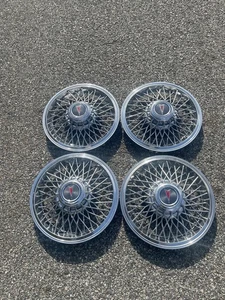 1982 to 1987 Pontiac Firebird  Grand Prix 14 inch wire spoke hubcaps MINT - Picture 1 of 23
