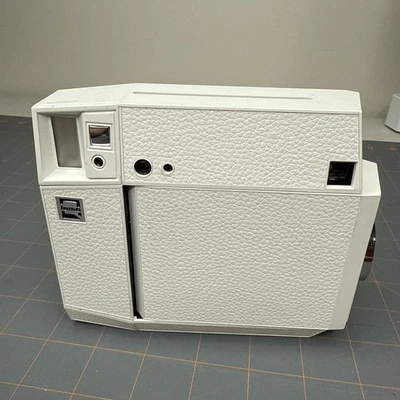 Lomo’ Square, White Working With Remote - Image 1 of 4