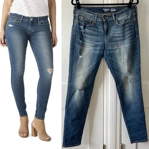 Jeans ajustados Levi’s Denizen tiro bajo desgastados lavado medio talla 13 - Imagen 1 de 15
