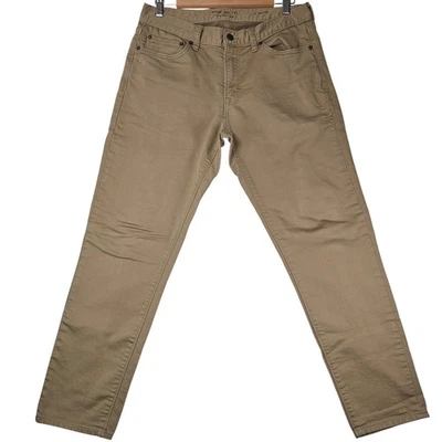 Pantalones de mezclilla para hombre Banana Republic Traveler calce atlético 31x30 caqui 2023 Foto 1 de 4