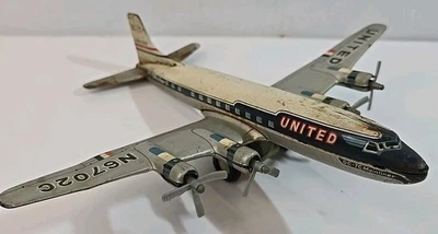 Vintage Yonezawa United Airlines DC-7C Mainliner N6702C Friction Metal Airplane - Image 1 of 4