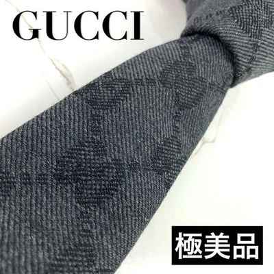 Corbata Gucci Gigante Patrón GG Lana Sólida 3.0 pulgadas Hoja Grande Gris Oscuro Foto 1 de 4