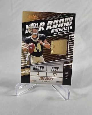 2023 Panini Absolute War Room Materials #WR-JHAE Jake Haener /99 RC MEM - Image 1 of 2