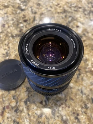 Lente Sigma Minolta Maxxum montura A, zoom-E, 28-70 mm, 1:3,5-4,5, con tapas de lente Foto 1 de 4