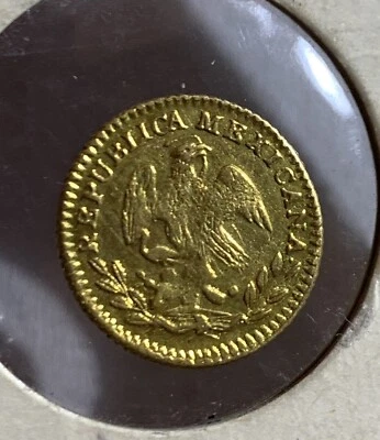 MONEDA DE ORO ESCUDO GO MEXICO 1853, SUPERFICIE RASGUÑADA Foto 1 de 2
