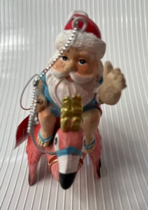 NEW! SANTA RIDING FLYING FLAMINGO ~ CHRISTMAS ORNAMENT ~ PLACE & TIME ~ 2024 - Picture 1 of 9