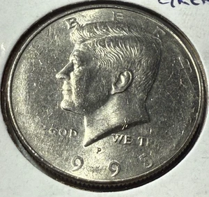 1995 P Kennedy Half Dollar Obverse Struck Thru Grease - Lot 138 - Picture 1 of 8
