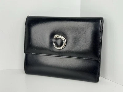 Cartera Cartier Panthère de Cartier de cuero triple pliegue - negra con herrajes plateados Foto 1 de 4