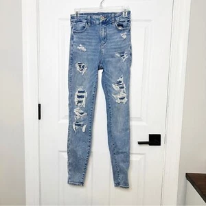 Pantalones de mezclilla AMERICAN EAGLE curvilíneos tiro alto parcheados medio desgastados 2 regulares - Imagen 1 de 7