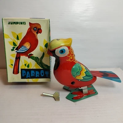 Juguete litográfico vintage de hojalata de loro saltador en caja original con llave funcionando  Foto 1 de 4