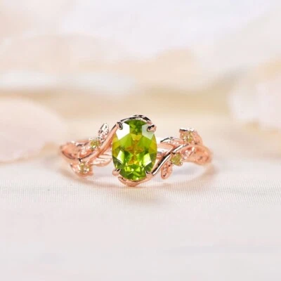 Anillo de propuesta de plata chapado en oro rosa de 14 quilates peridoto genuino corte ovalado hoja ramita Foto 1 de 4