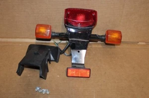 2003 - 2023 HONDA RUCKUS NPS 50 TAILLIGHT BRACKET COMPLETE OEM - Picture 1 of 7