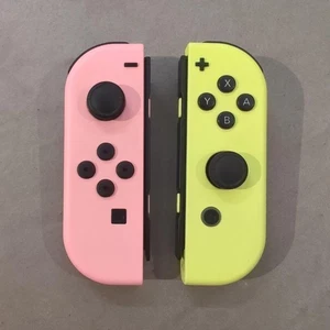 Juego de mandos Joy-Con oficiales Nintendo Switch rosa pastel y amarillo probado - Imagen 1 de 6