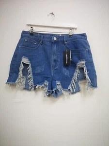 Pretty Little Thing Plus Mid wash Thigh Rip Denim Short - Picture 1 of 2