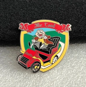 Prendedor de refuerzo Disney Mr. Toad Wild Ride Riding in Red Car Shield - Imagen 1 de 1