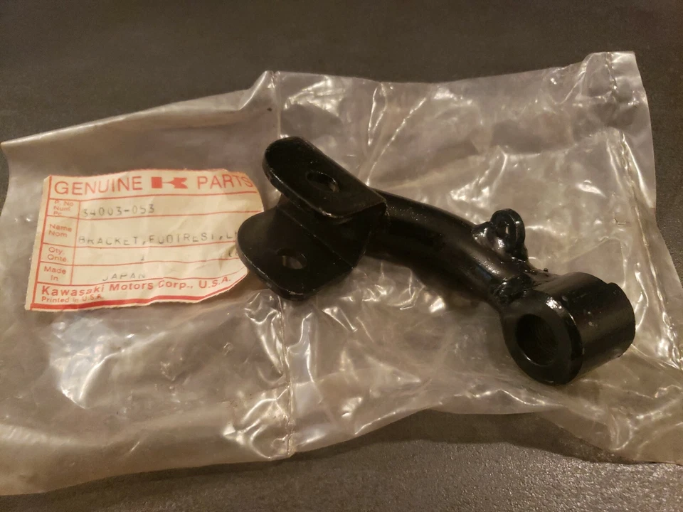 NOS Kawasaki OEM Footrest Holder LH 74-78 KZ400 DLX STD Special 34003-053 - Image 1 of 4