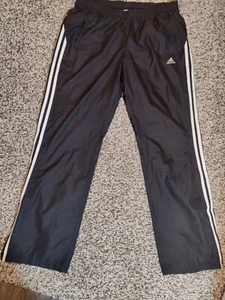 Pantalones Adidas Para Hombre Pista Mediana Cortavientos 3 Rayas Bordado Logo Negro - Imagen 1 de 11