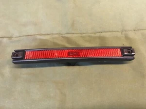 1984 - 1988 PONTIAC FIERO LEFT REAR SIDE MARKER LIGHT GM 16501539 OE NOS RED - Picture 1 of 5