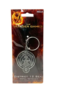 THE HUNGER GAMES DISTRICT 12 SEAL KEYCHAIN - Picture 1 of 3