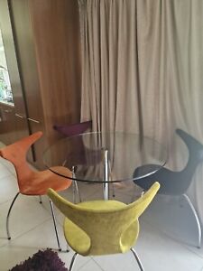 NOVARA 100cm Round Glass and Black Leg Dining Table & 4 Belgravia Chairs