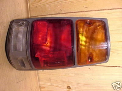 HONDA PASSPORT 94-97 Isuzu Rodeo 91-97 LUZ TRASERA PASAJERO DIESTRO moldura negra Foto 1 de 2