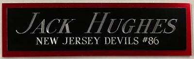 JACK HUGHES NJ DEVILS NAMEPLATE FOR AUTOGRAPHED Signed STICK JERSEY PHOTO PUCK - Image 1 of 4
