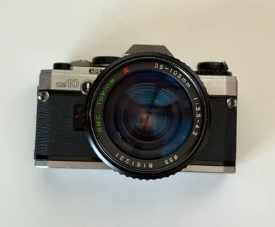 Olympus OM-10 SLR Film Camera & Adapter & 35-105mm F/3.5-4.5 Tokina lens - Image 1 of 4