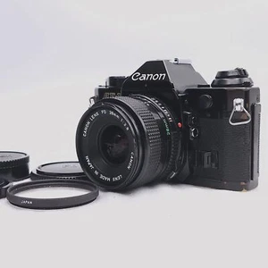 [Exc+5] Canon AE-1 Programa Negro SLR Cámara fotográfica NFD 28 mm f/2,8 S.C Lente JAPÓN - Imagen 1 de 24