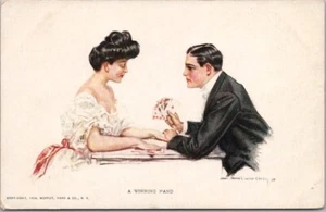 Künstlersignierte H.C. CHRISTY Postkarte "EINE GEWINNENDE HAND" Paar / Spielkarten - Bild 1 von 2