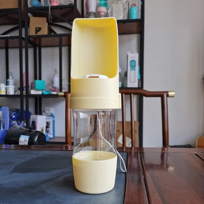 Botella de agua de viaje 2 en 1 para perros dispensador de agua para mascotas alimentador comedero para perros Ou Foto 1 de 4