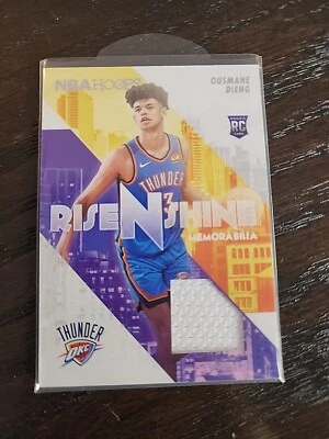 2022-23 PANINI NBA HOOPS OUSMANE DIENG RISE N SHINE ROOKIE JERSEY RELIC THUNDER - Image 1 of 2